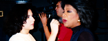Houston Makeup Artist Cinthia Moore applying makeup to Oprah Winfrey on the set at KHOU 11 Houston